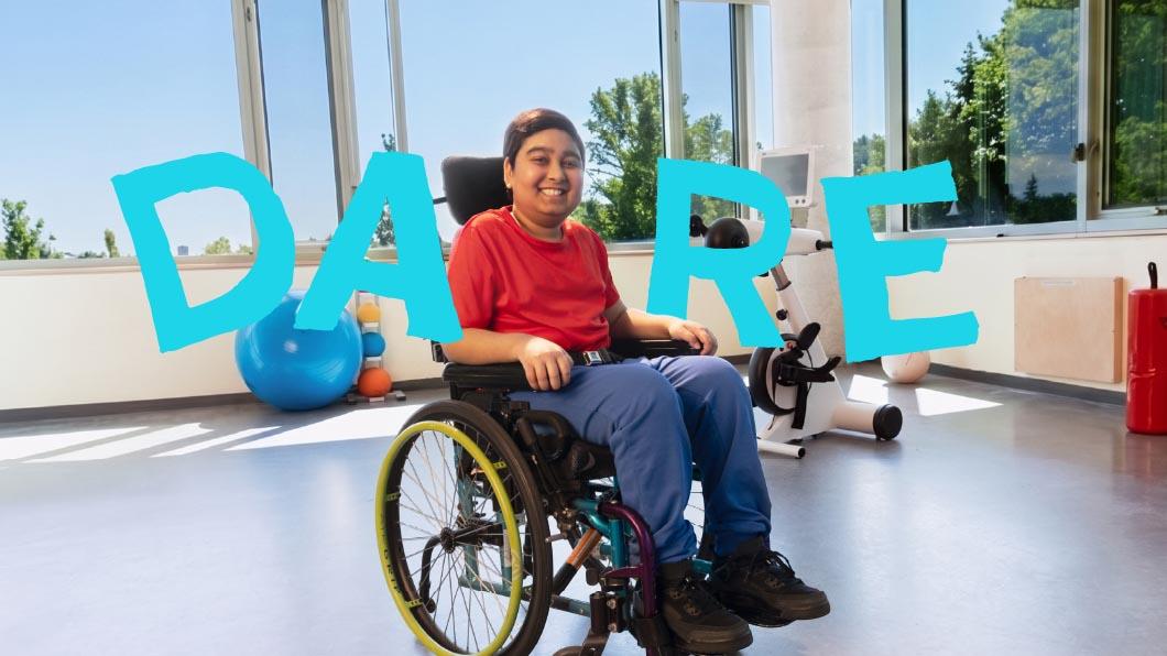 A teenager on a wheelchair, with the word "DARE"
