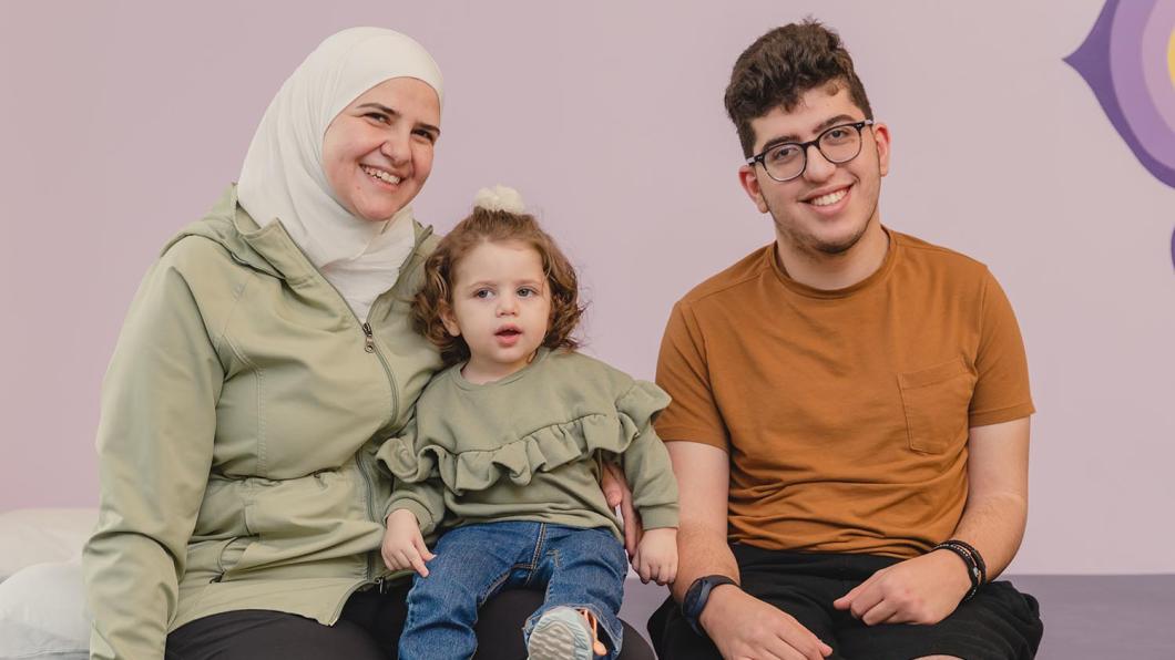 An adult with 2 children