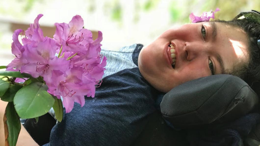 Boy in a wheelchair smiling
