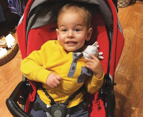 Noah in a red stroller