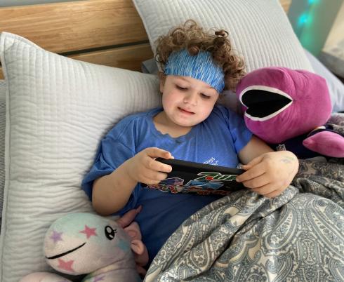 Phoenix playing on his iPad. 