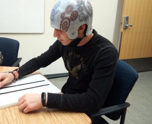 Jacob wearing his helmet on his rehabilitation journey.