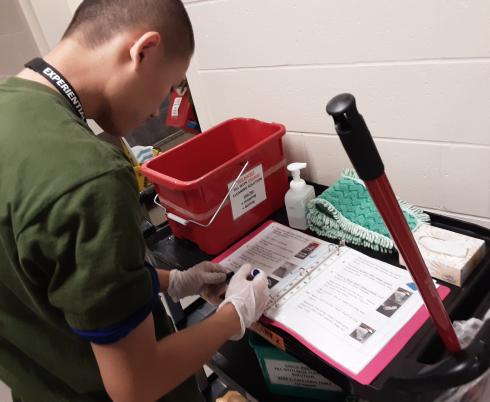 Student looking over the checklist. 