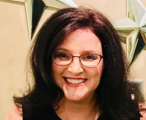 Kathy smiling at the camera.