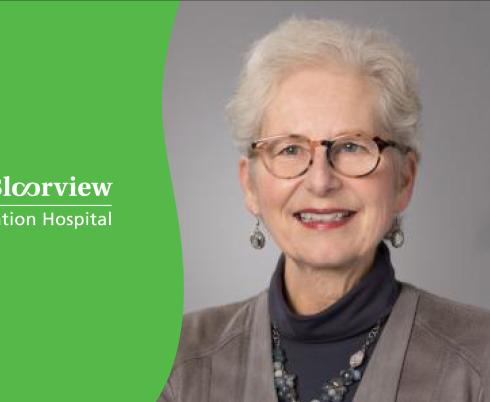 A photo of Marg Rappolt smiling against a grey backdrop is positioned next to a green and white Holland Bloorview background.