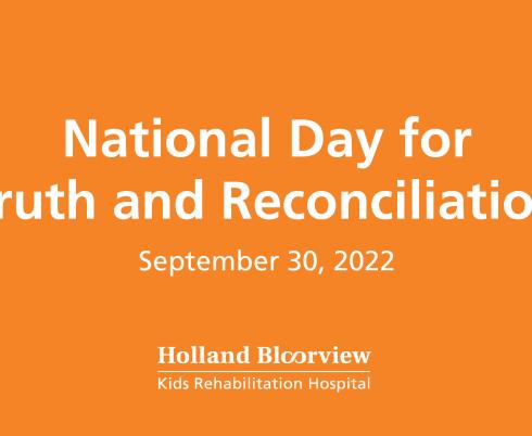 Orange sign reading "National Day for Truth and Reconciliation, September 30, 2022" in white text