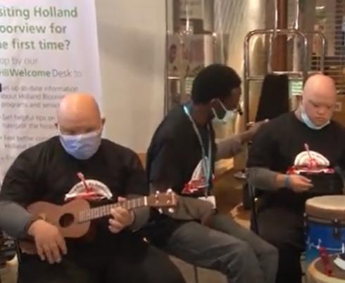 Several clients playing instruments in Holland Bloorview's Coriat Atrium
