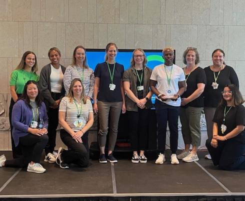 Group photo of some people standing on a stage