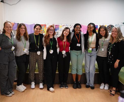 A group of people standing and having a photo together