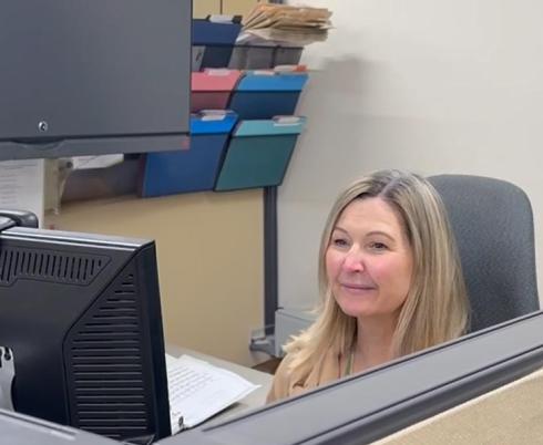 Sharon Ouellette at her desk