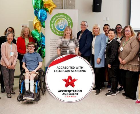 A group of people with the Accreditation Canada badge