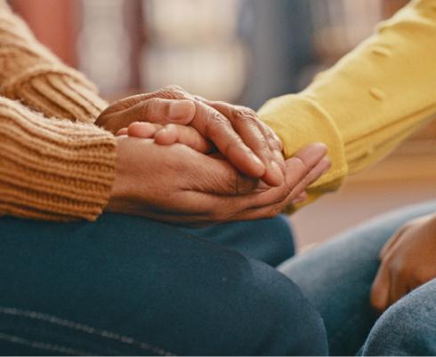 Some hands holding each other